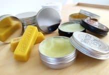 beard balm tins on a table