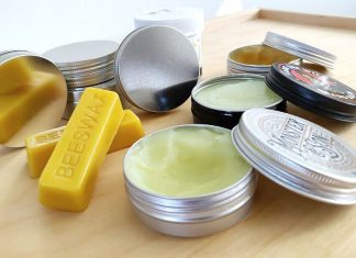 beard balm tins on a table