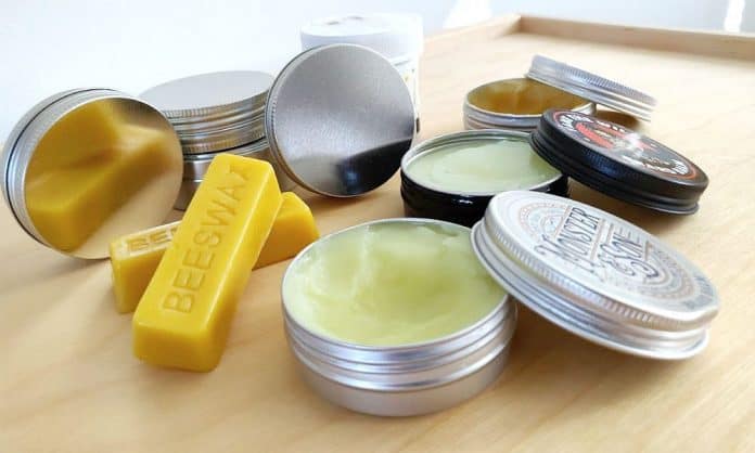 beard balm tins on a table