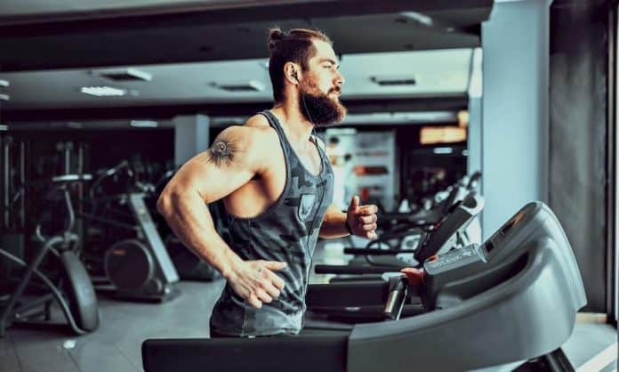 bearded man running on a treadmill