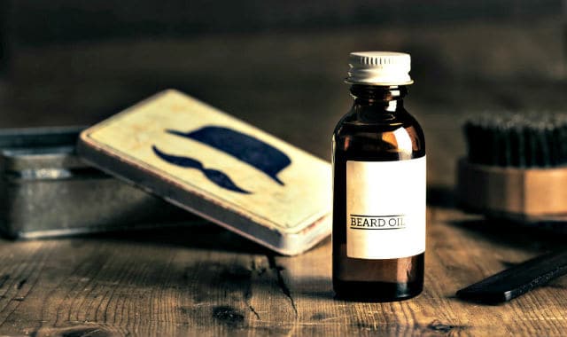 beard oil and other care products on a table