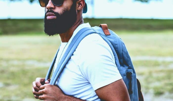 black man with a full ducktail beard