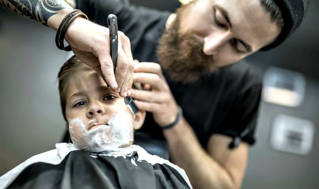 kid getting a shave