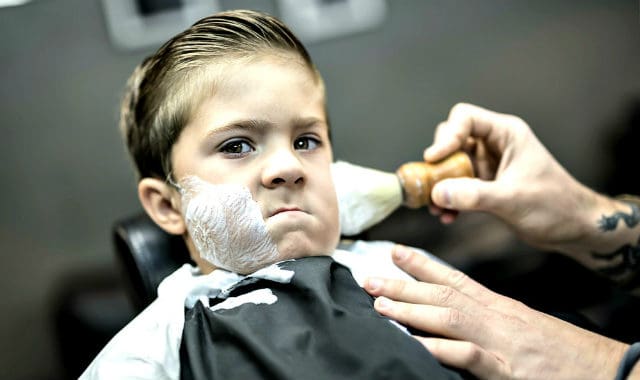 little boy getting a shave