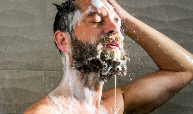 man washing the beard