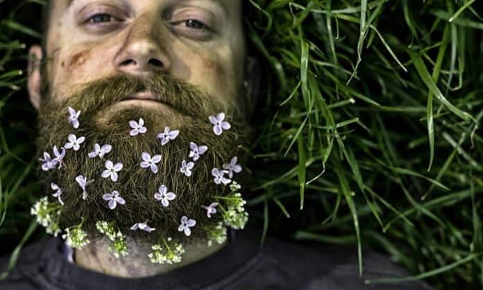 man with a dirty beard with flowers on it