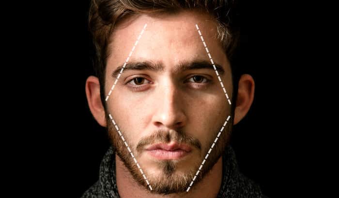 man with diamond face shape and heavy stubble beard