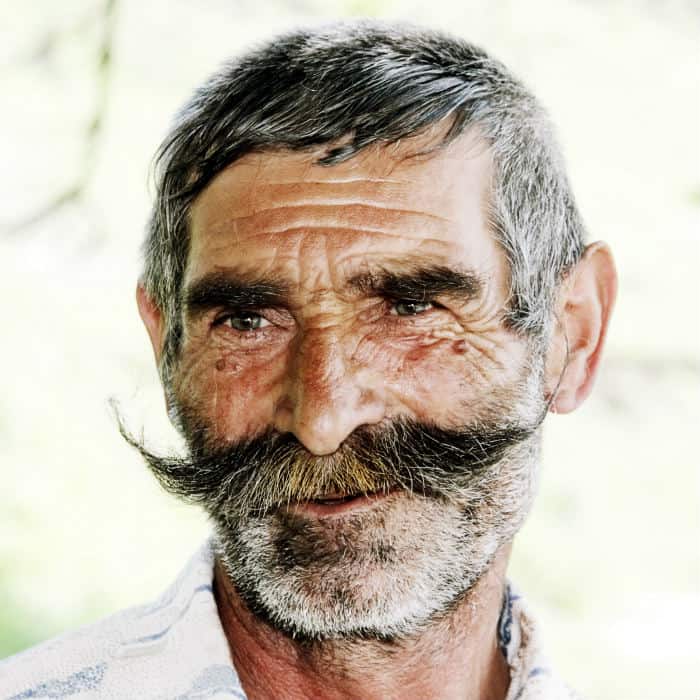 man with massive hungarian mustache and stubble