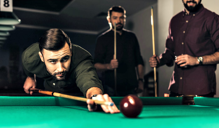 men playing pool