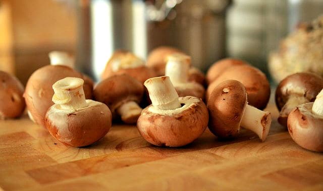 white button mushrooms on a table