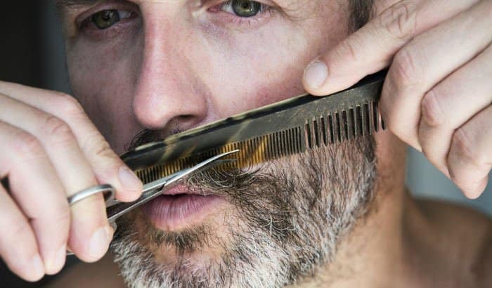 trimming salt pepper mustache with beard scissors