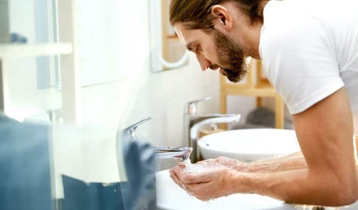 washing the beard over sink