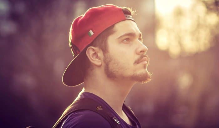 young man with a patchy chinstrap beard style