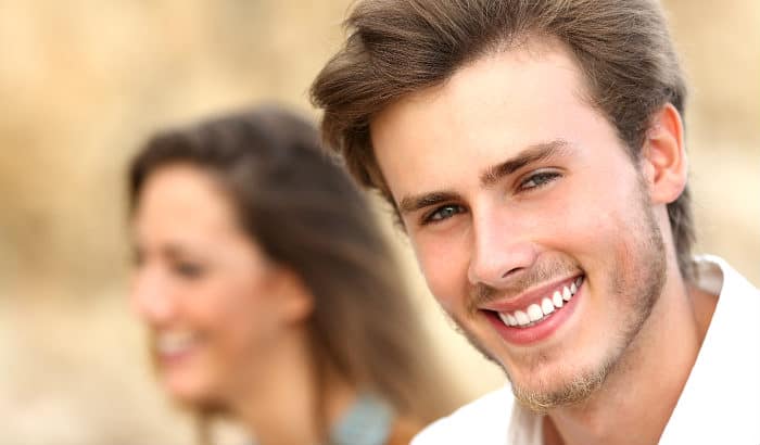 young man with a peach fuzz mustache